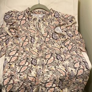 Paisley beige blouse with ruffle sleeves and button down.